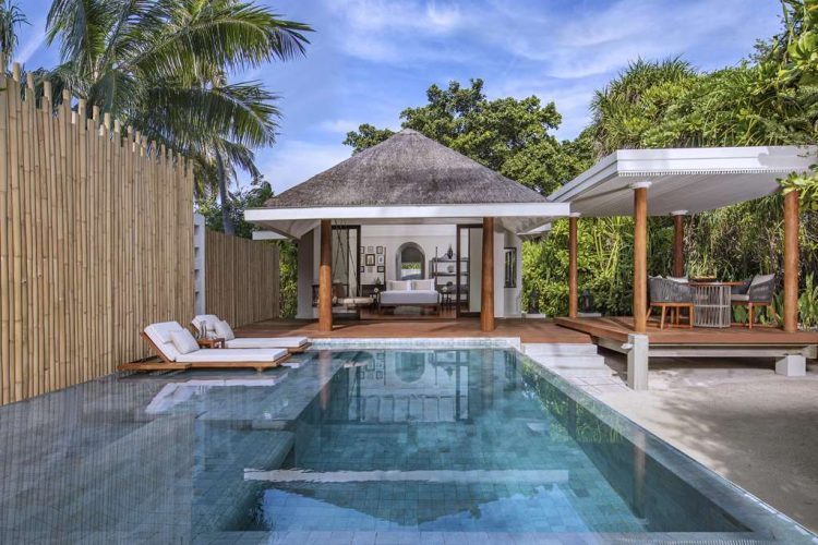 Daylight view of swimming pool and exterior of one bedroom familybeach pool villas