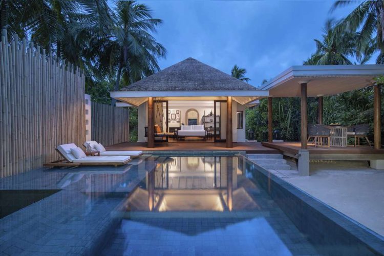 Twilight view of swimming pool and exterior of 1bedroom familybeach pool villas