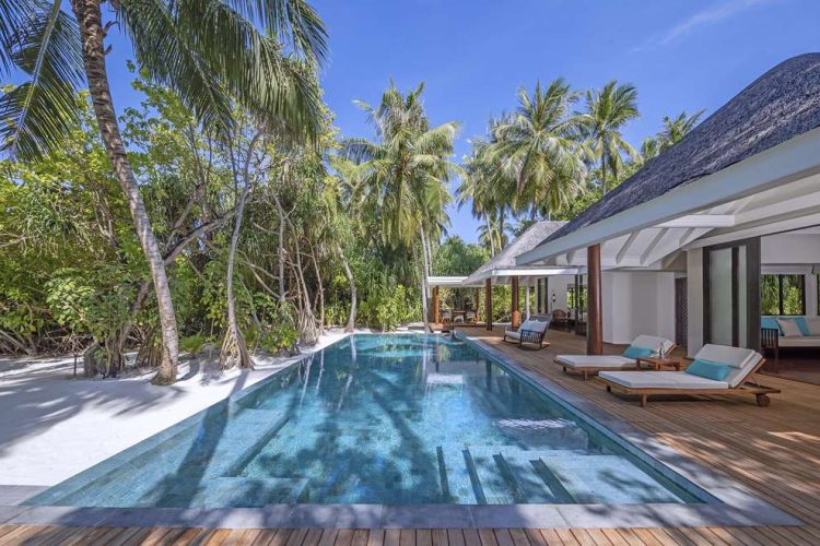 Exterior view of swimming pool and outdoor deck of villa