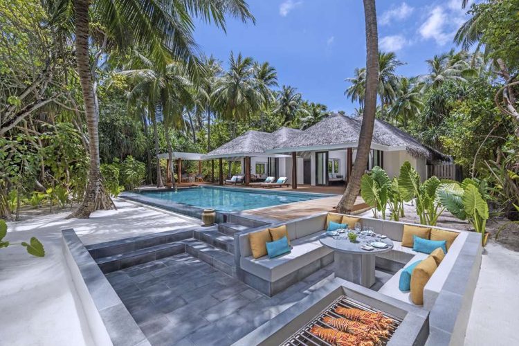 Exterior view of bbq pit, swimming pool and outdoor deck of villa