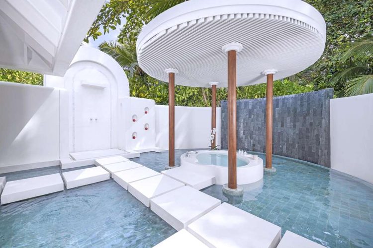 Outdoor shower and bathtub in master bathrooms of all beach villas categories