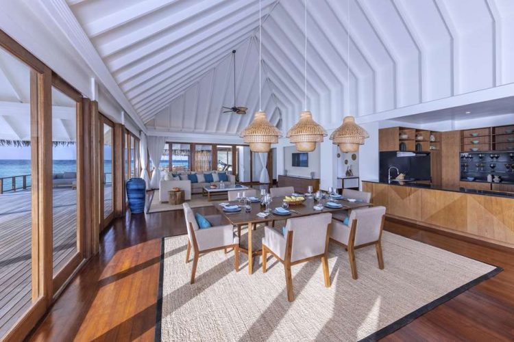 Dining table, kitchen and living room of residence