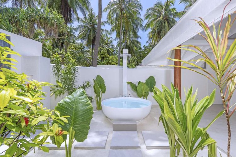 Bathtub in bathroom of twin ensuite in villa