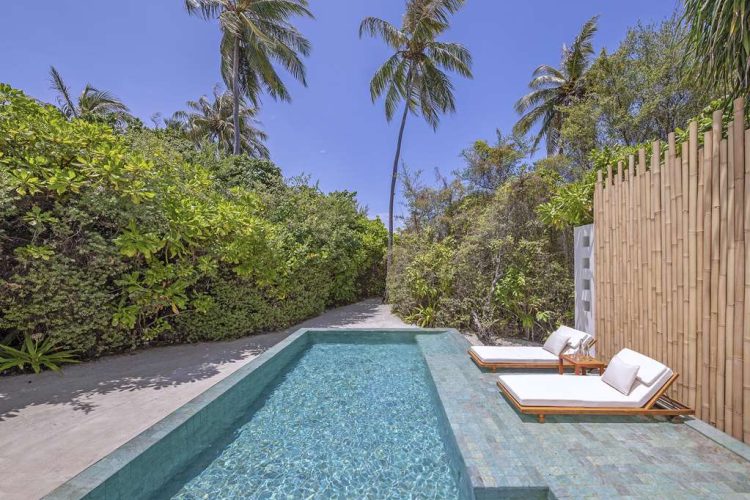 Daylight view of swimming pool and beach pathway of one bedroom familybeach pool villas