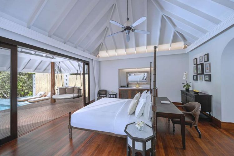 Interior of villa with view of the outdoor deck and pool