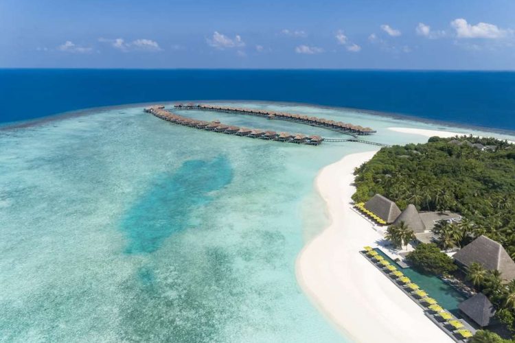 Aerial view of Manzaru Restaurant, the beach and the Over Water Villas