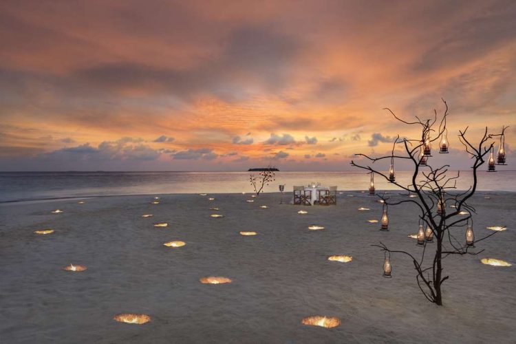 Exterior view of Dining By Design on beach at sunset