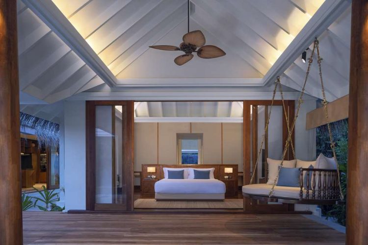 Interior view of master bedroom in Beach Pool Residence from terrace with swing
