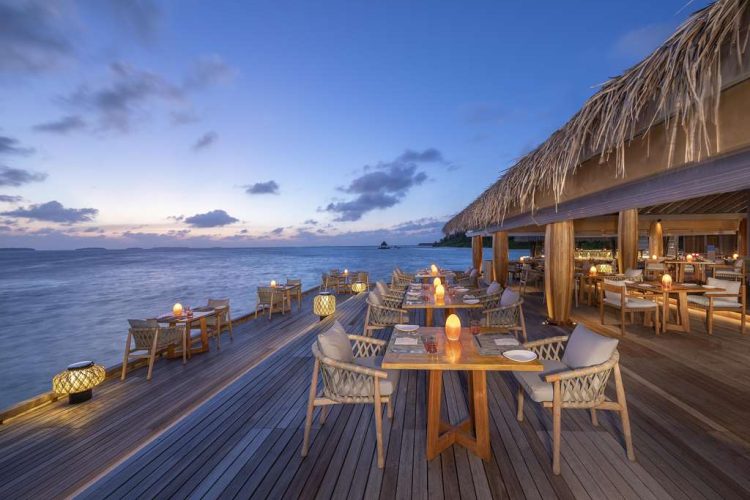 Exterior view of dining area at SPICE Restaurant with ocean view