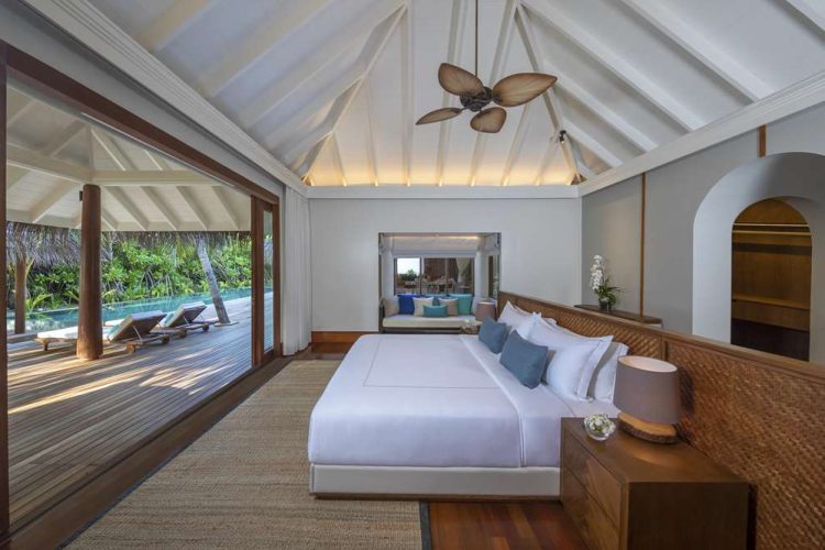 Interior view of master bedroom in Three Bedroom Beach Pool Residence with outdoor terrace and swimm