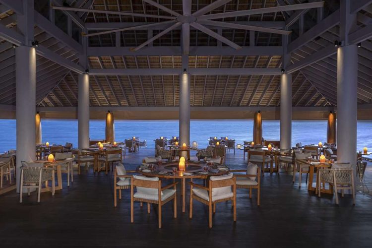 Interior view of dining setup in SPICE Restaurant with ocean view