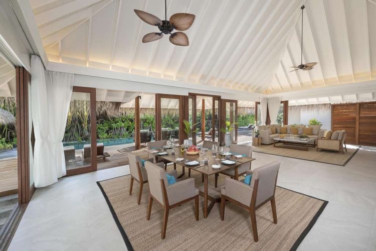 Interior view of dining area and lounge in Beach Pool Residence with outdoor terrace and swimming po