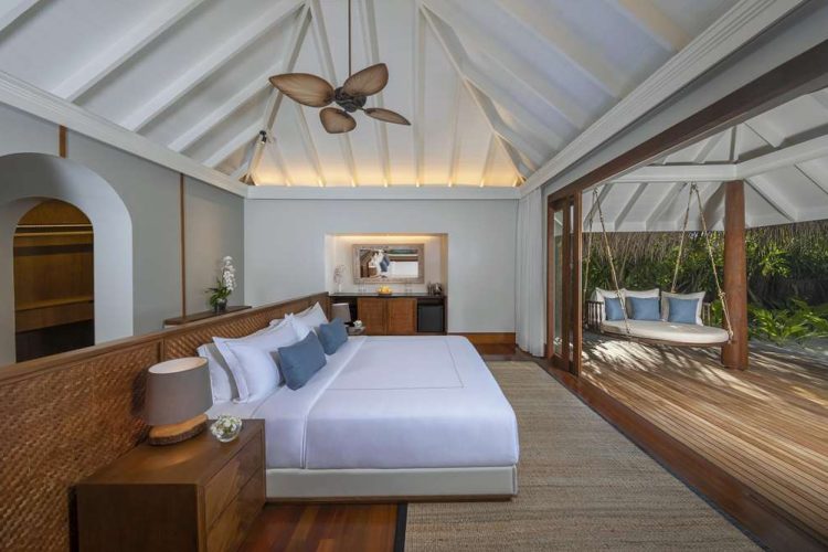 Interior view of master bedroom in Three Bedroom Beach Pool Residence with view of outdoor terrace