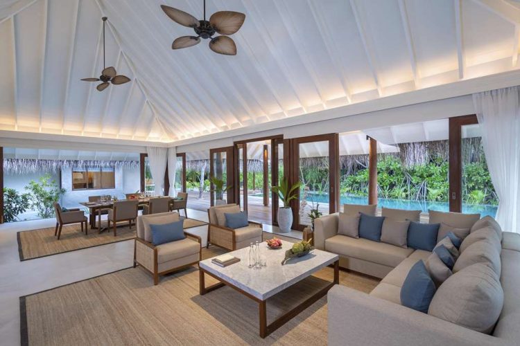 Interior view of lounge and dining room in Two Bedroom Beach Pool Residence with outdoor terrace and
