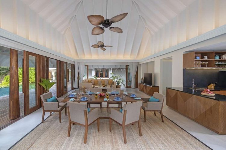 Interior view of dining area, kitchen and lounge in Two bBedroom Beach Pool Residence with view of o