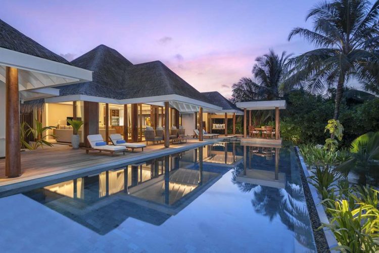 Exterior view of swimming pool and outdoor terrace with sun-loungers, Thai sala and swing at Two Bed