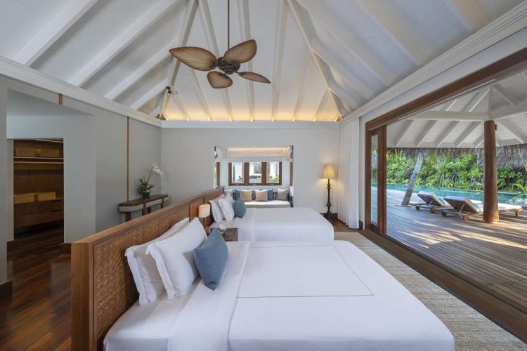 Interior view of twin bedroom in Three Bedroom Beach Pool Residence with outdoor terrace and swimmin