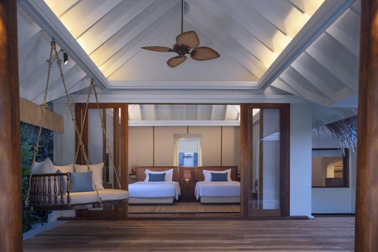 Interior view of twin bedroom in Beach Pool Residence from terrace with swing