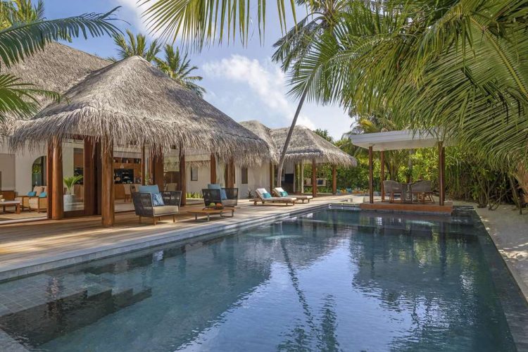 Exterior view of swimming pool and outdoor terrace with sun-loungers, Thai sala and swing at Two Bed