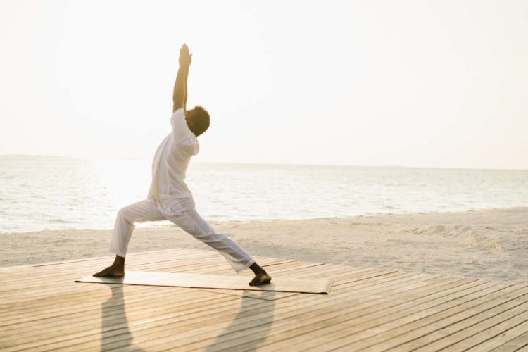 Yoga on the beach in the morning