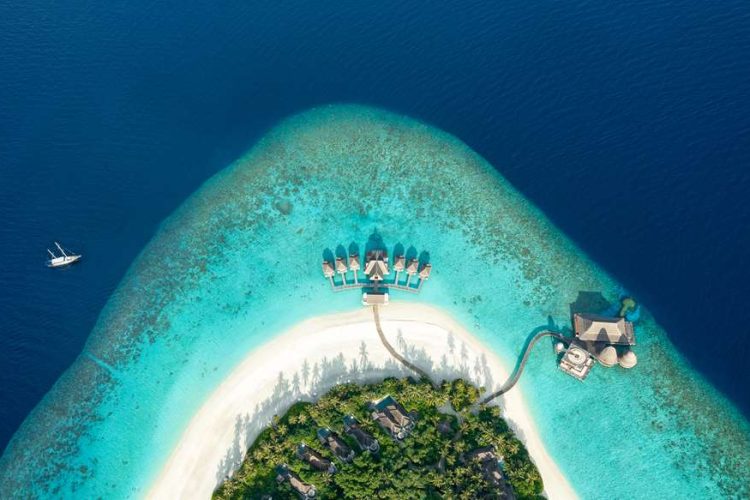 Aerial drone photo of the beautiful beach and expansive reefs surrounding the island of Anantara Kih
